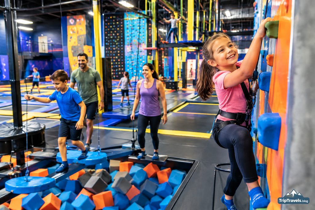 Urban Air Adventure Park family enjoying indoor climbing trampolines and exciting adventure activities